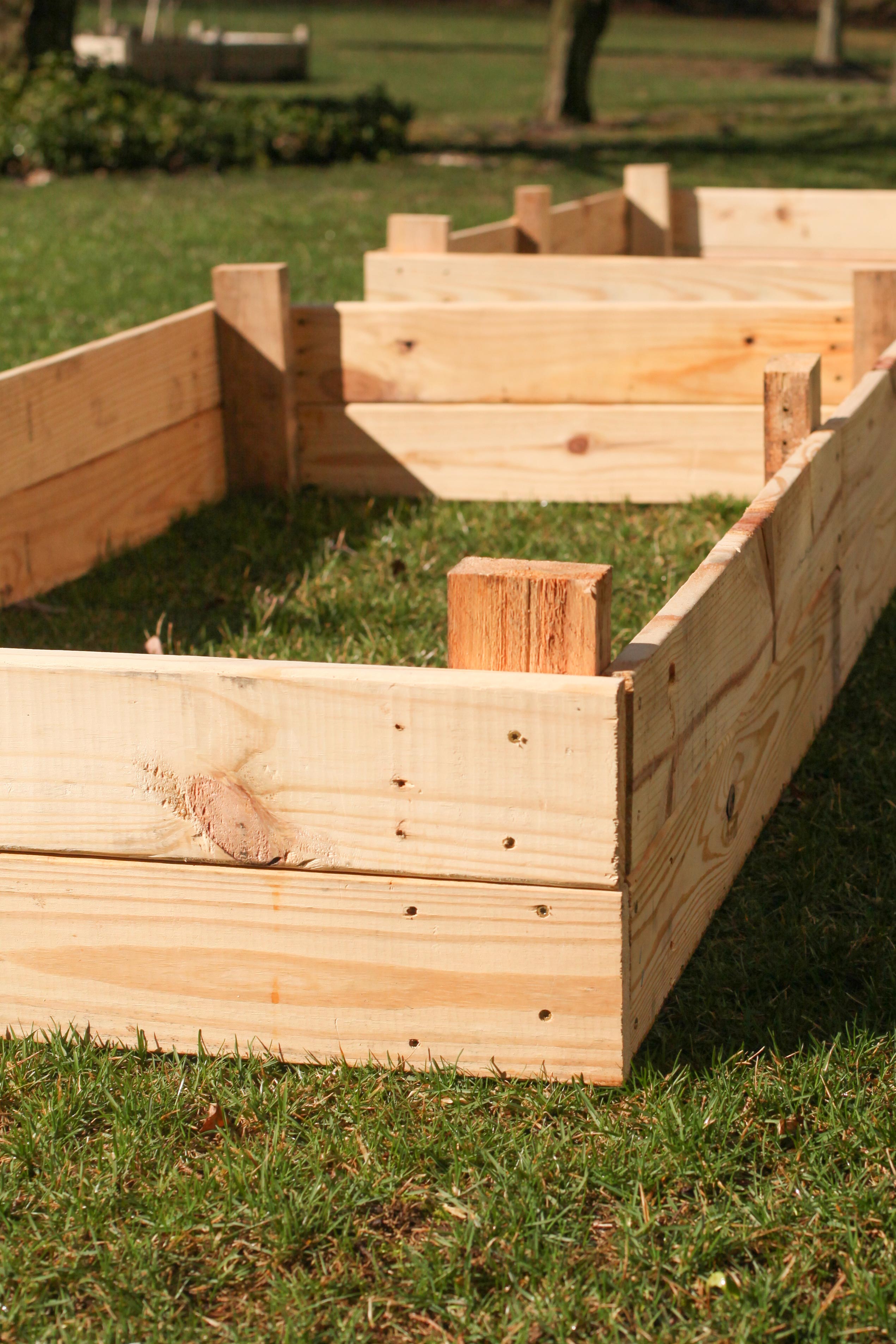 wooden raised garden bed on grass