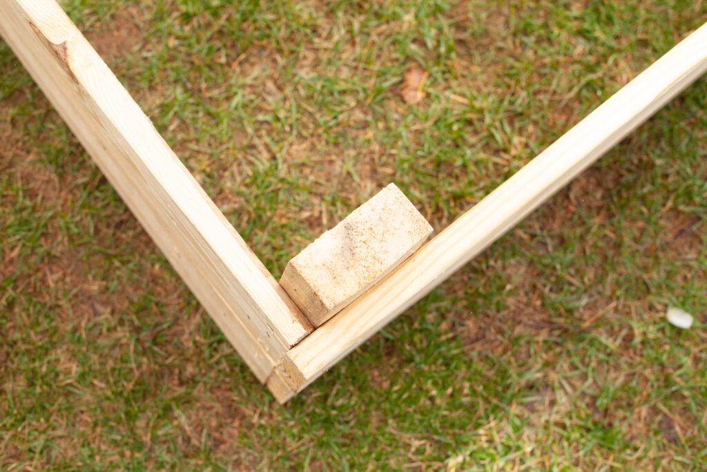 corner of a wooden garden bed