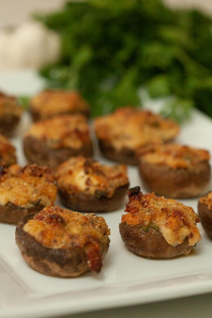 stuffed mushrooms on a white plate