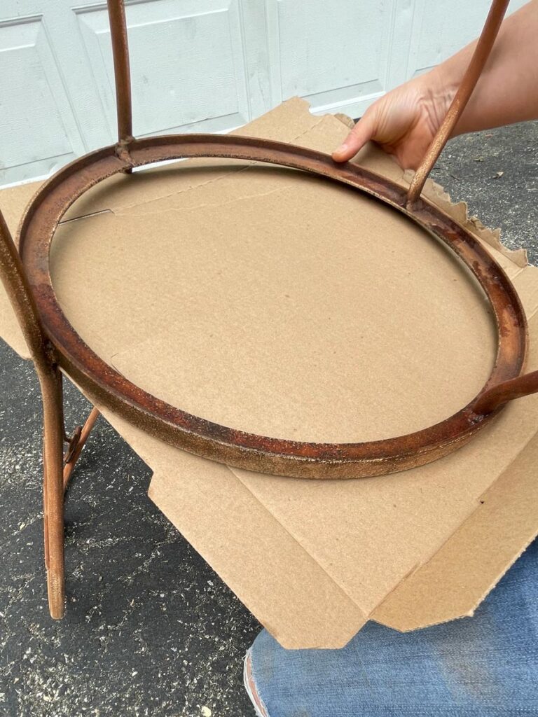 Cardboard under an old vintage chair