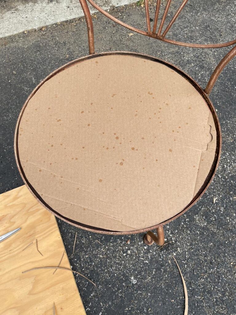 Cardboard on a rusty vintage chair
