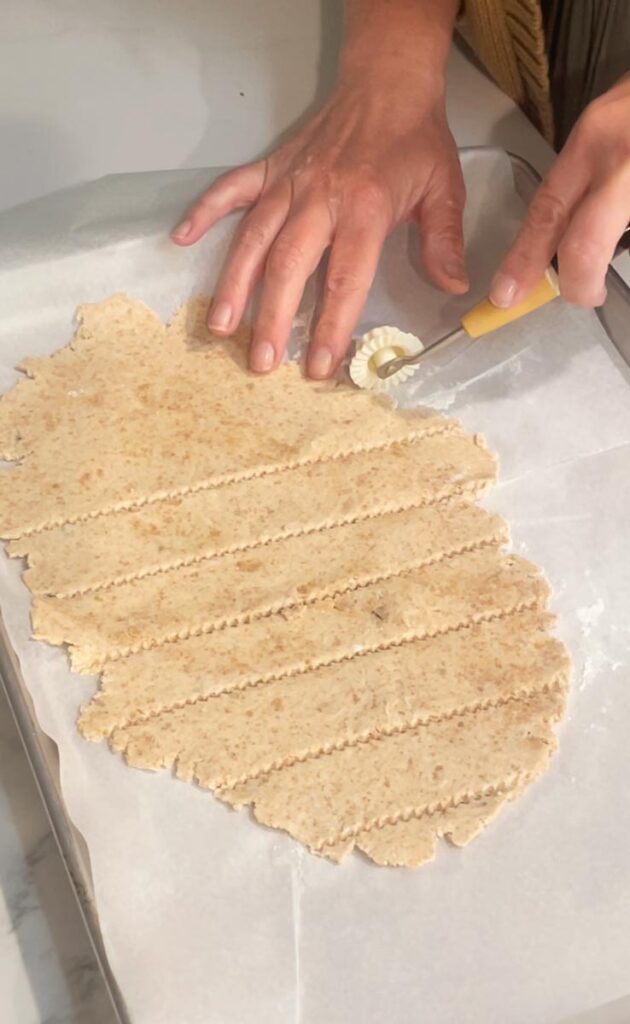 cutting dough to make crackers