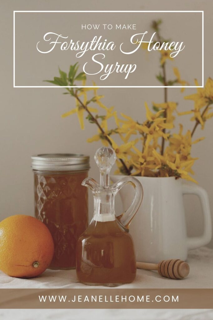 Syrup on glass jar next to forsythia flowers