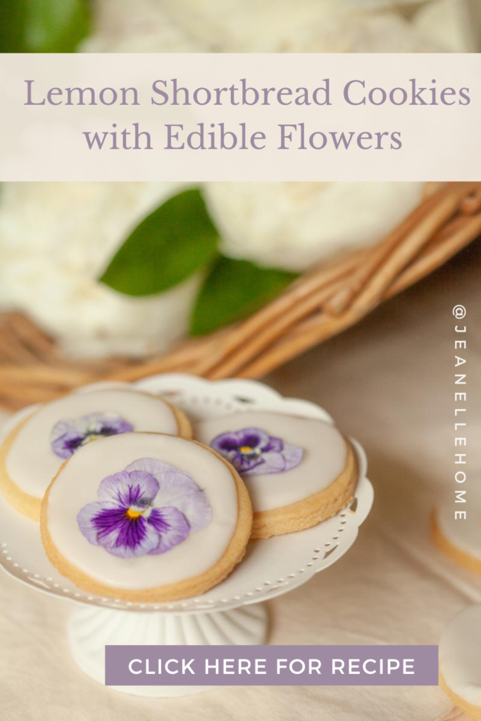 lemon shortbread cookies with violets on a platter