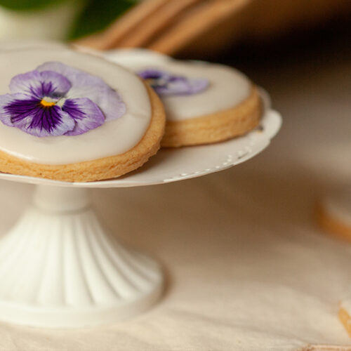 Violet cookies on a white platter