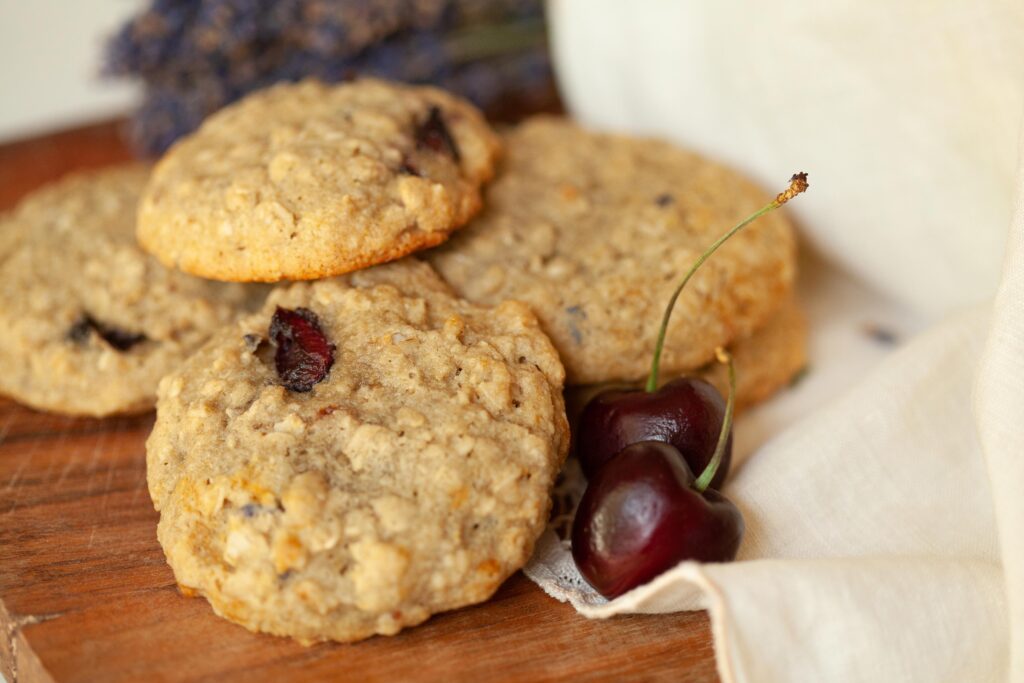 Sourdough Oatmeal cookies next to cherries