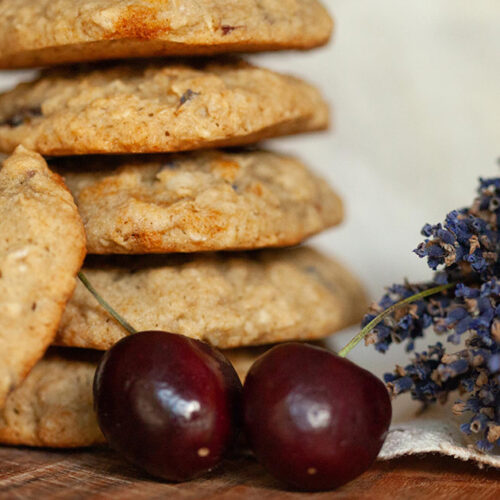 Oatmeal Cookies Stacked next to lavender and cherry