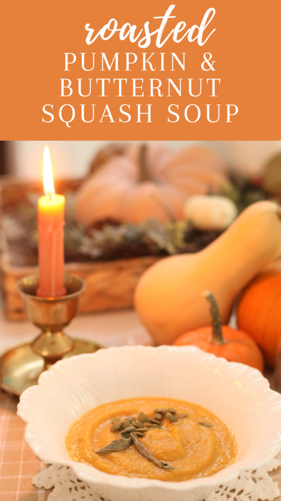 bowl of soup next to a candle and a butternut squash and pumpkin